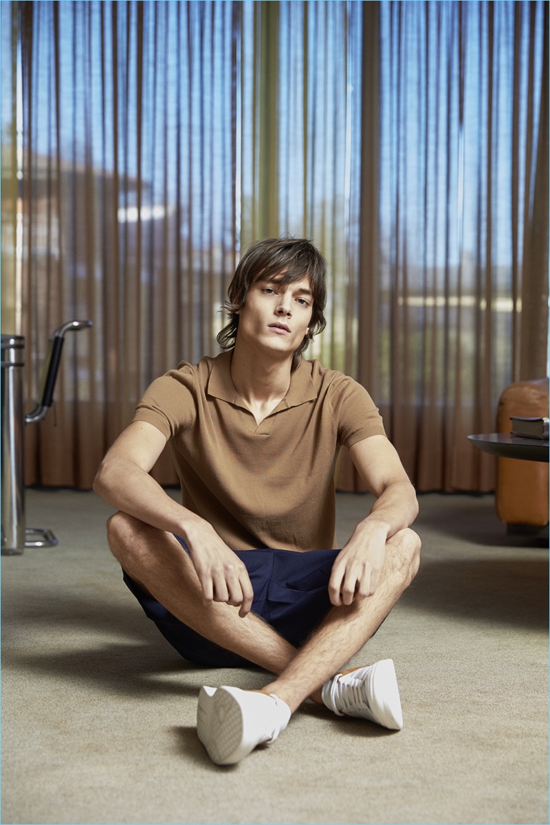 Embracing casual summer style, Timur Muharemovic wears a retro-style polo and shorts by David Naman.