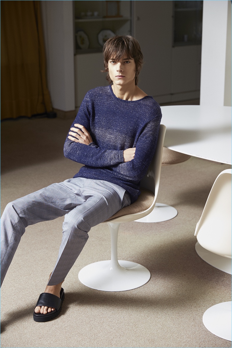 Showcasing a chic leisure look, Timur Muharemovic wears David Naman's degrade sweater with check trousers.