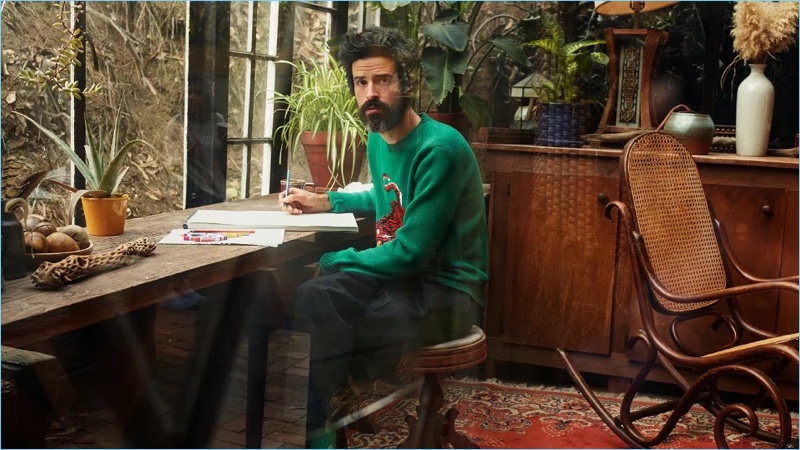 Connecting with Mr Porter, Devendra Banhart wears a Gucci tiger sweater and Bottega Veneta wide-leg trousers.