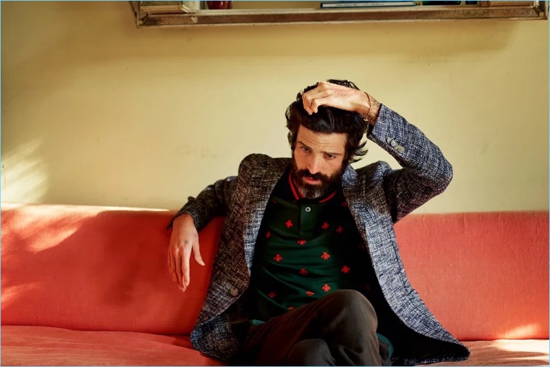 Mixing textures and prints, Devendra Banhart wears an Etro blazer with a Gucci polo and Incotex trousers.