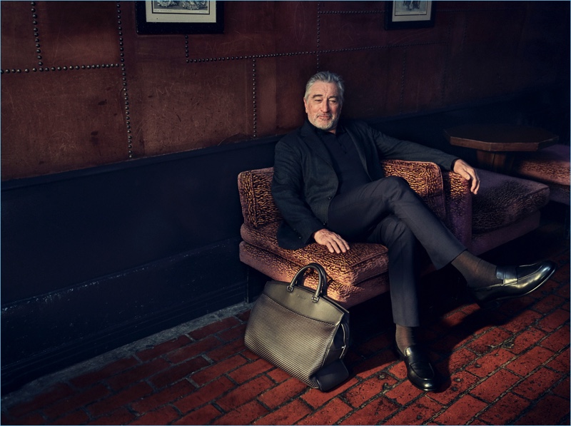 Actor Robert De Niro retreats indoors for a sartorial moment in Ermenegildo Zegna tailoring.