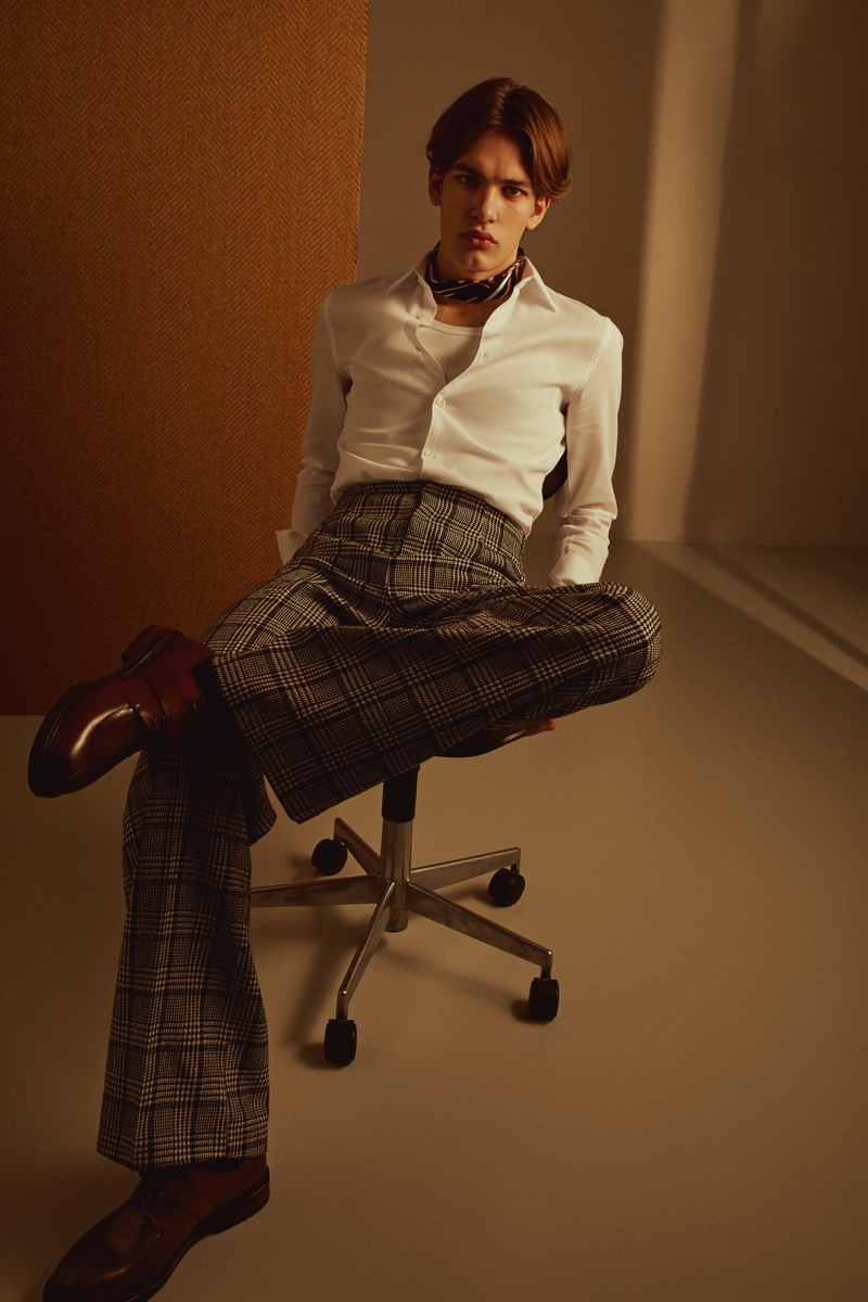 Frederik wears scarf H&M, pants stylist's own, shirt and shoes Zara.