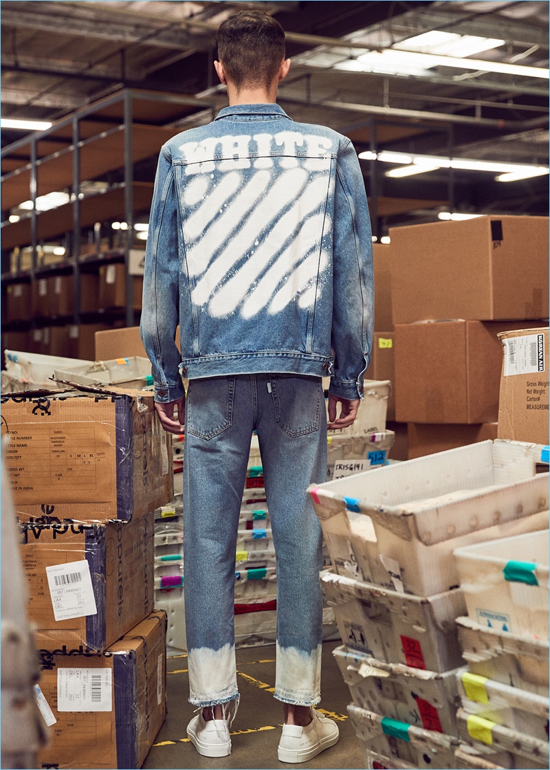 Doubling down on denim, Simon Kotyk rocks a diagonal spray denim jacket and jeans from Off-White. Simon also sports Common Projects sneakers.
