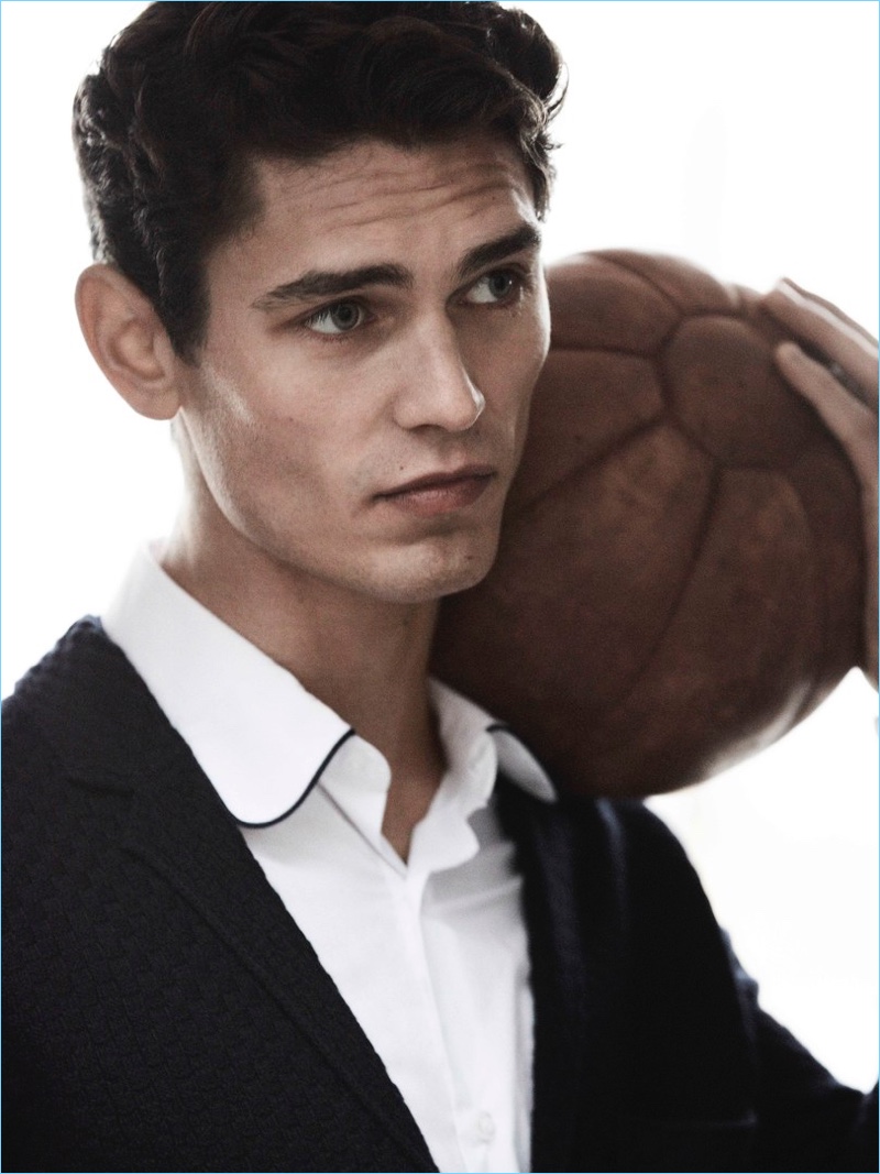 French model Arthur Gosse wears a shirt and cardigan from Massimo Dutti.