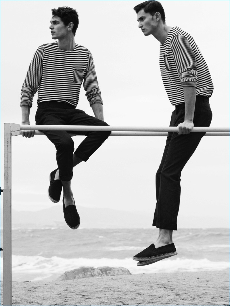 Sporting matching ensembles, Arthur Gosse and Dimytri Lebedyev wears striped pullovers from Massimo Dutti.