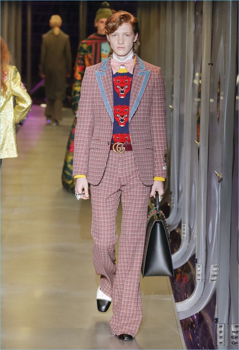 Plaid suiting comes together with cheeky knitwear for Gucci's fall-winter 2017 lineup.
