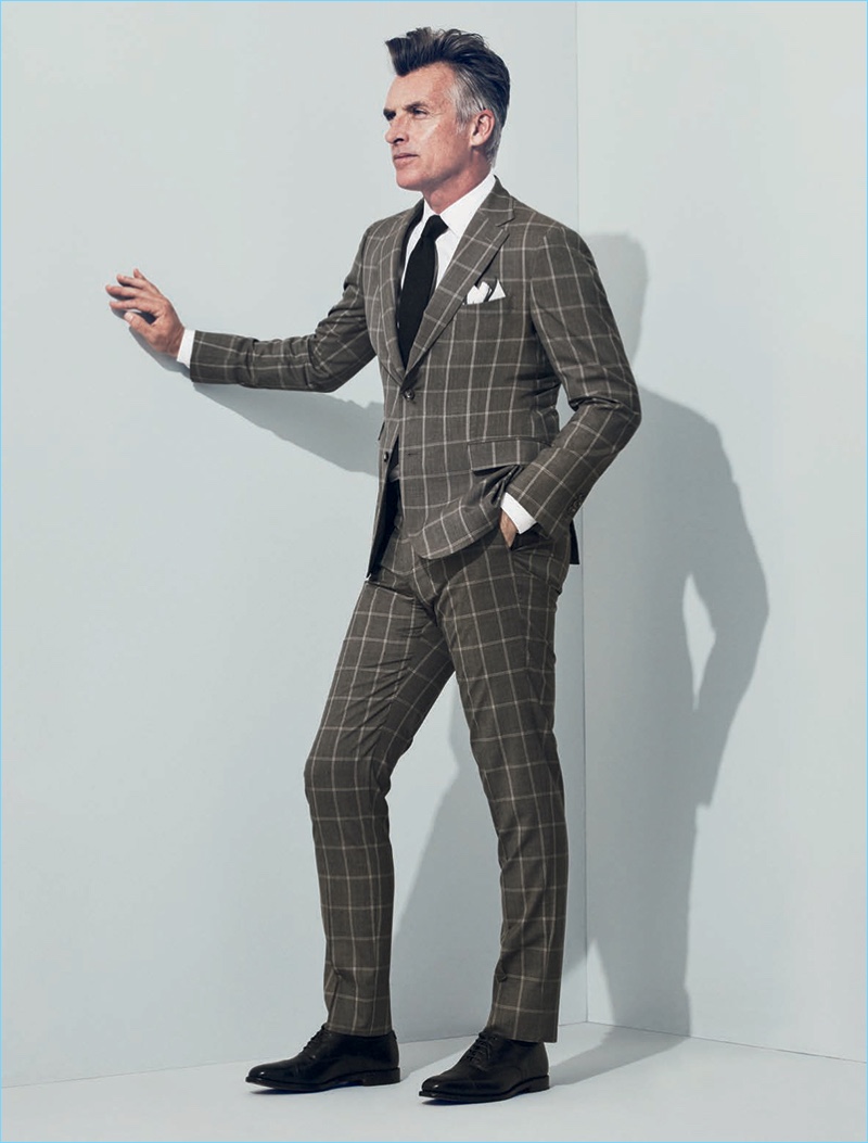 Making a sound sartorial impression, John Pearson wears a J.Hilburn windowpane print suit.