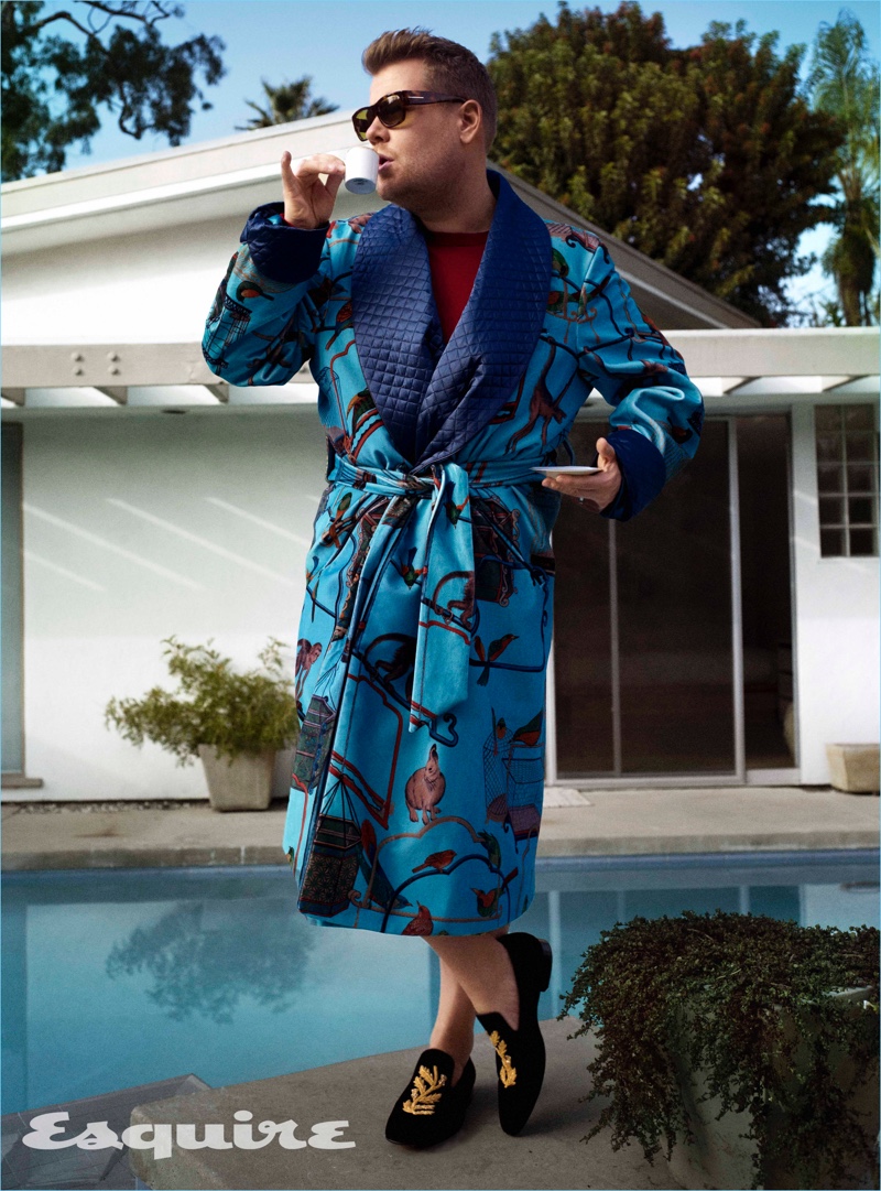 Late night host James Corden wears a New & Lingwood robe with a sweater and loafers by Burberry. Corden also rocks Tom Ford sunglasses.