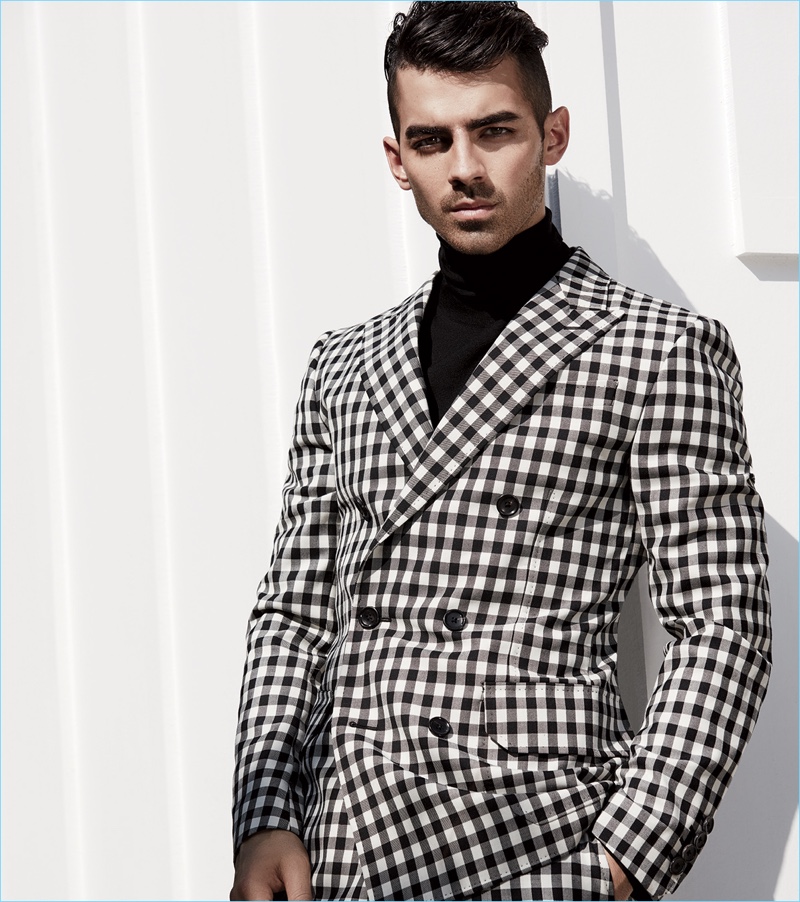 DNCE frontman Joe Jonas sports a black and white check suit with a turtleneck by Bally. » Joe Jonas Covers Gotham, Recalls Disney Days DNCE frontman Joe Jonas sports a black and white check suit with a turtleneck by Bally.