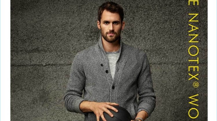 Standing tall, Kevin Love dons a cardigan sweater with a tee and wool pants by Banana Republic.