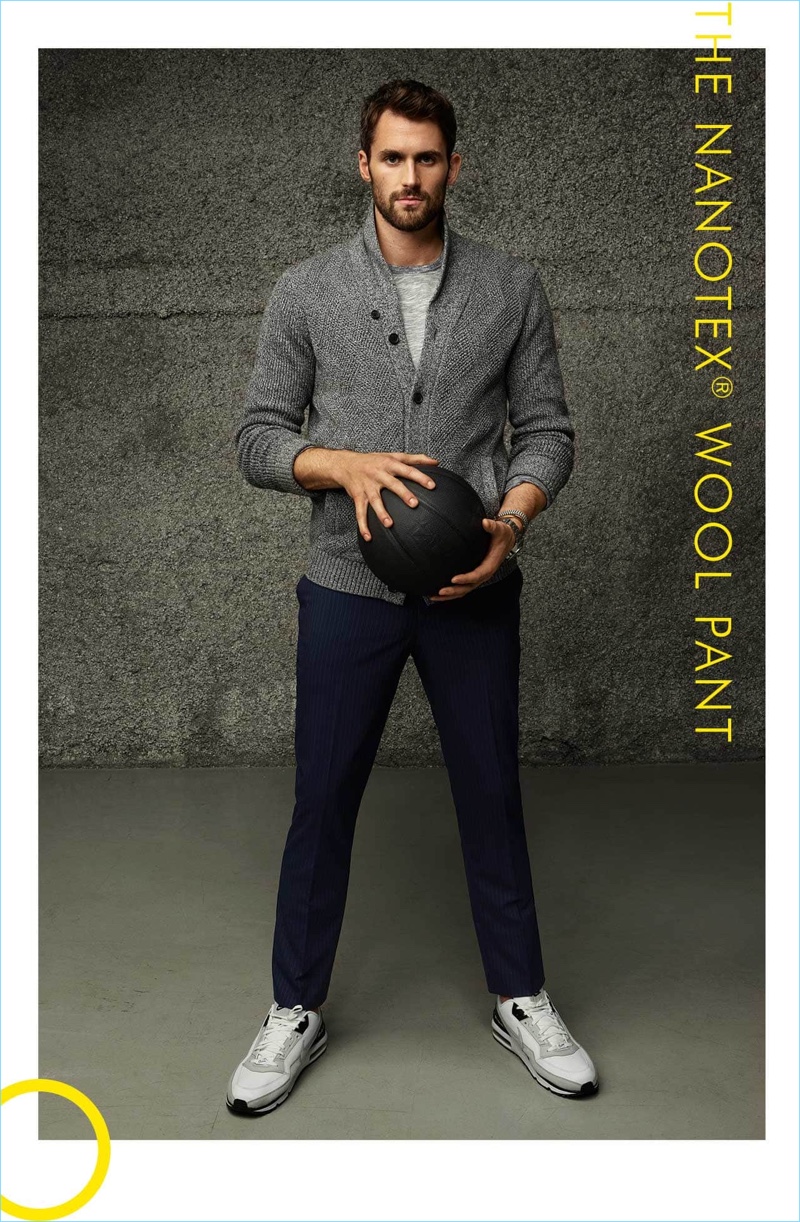 Standing tall, Kevin Love dons a cardigan sweater with a tee and wool pants by Banana Republic.