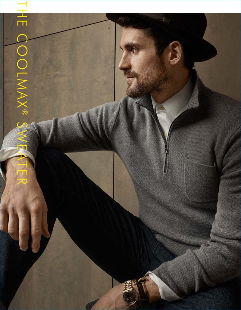 Basketball player Kevin Love plays its cool in a fedora. Love sports Banana Republic's half-zip sweater over a shirt with casual brands.