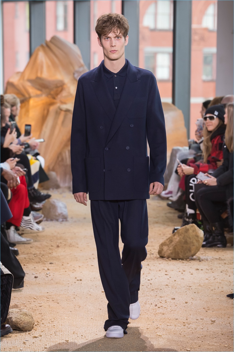 Lacoste drops the cut on its double-breasted suit for fall-winter 2017. » Lacoste Brings the 90s Back with Aviator Inspired Fall '17 Collection Lacoste drops the cut on its double-breasted suit for fall-winter 2017.