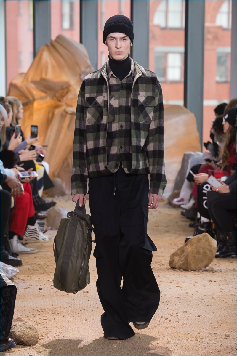 Baggy pants make a comeback as Lacoste pairs the statement piece with plaid outerwear.