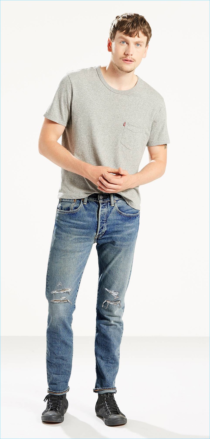 Ripped denim is front and center with Levi's 501 skinny jeans Bad Boy style.