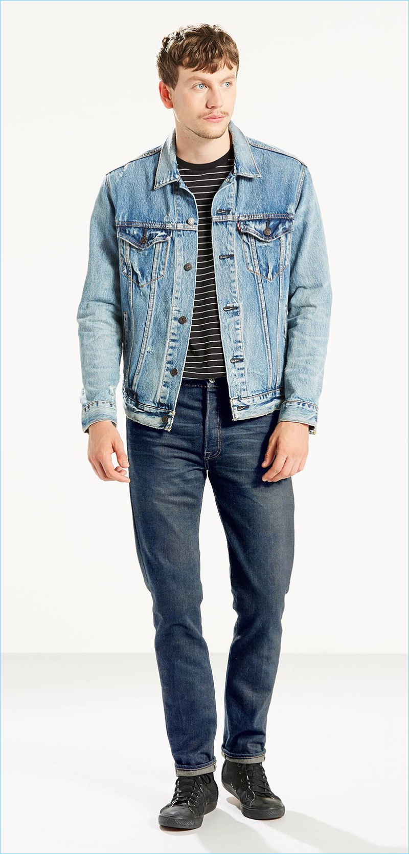 Sid Ellisdon models Levi's 501 skinny jeans in the brand's Rocks wash.