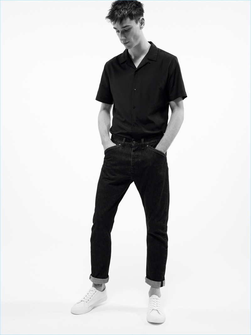 Harvey James embraces black denim with a Cuban collared short-sleeve shirt from Mango Man.