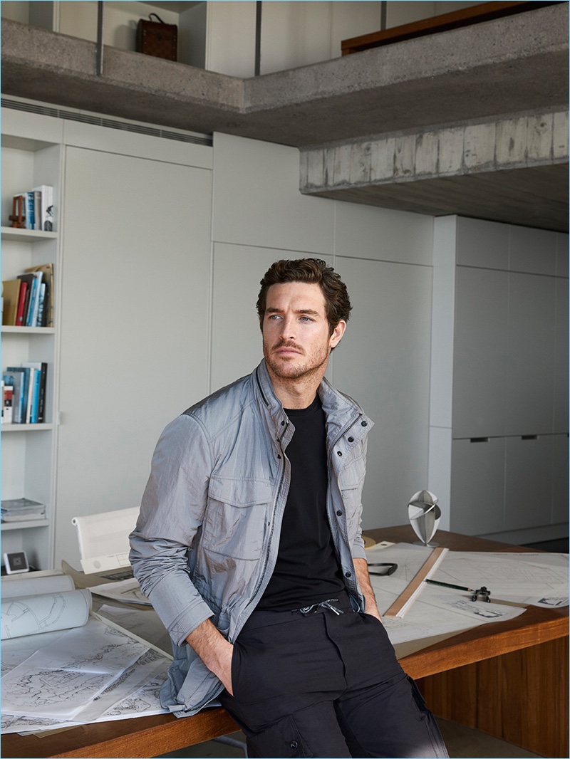 Wearing casual styles from Massimo Dutti's Soft Collection, Justin Joslin sports a technical jacket with a tee and cargo pants.