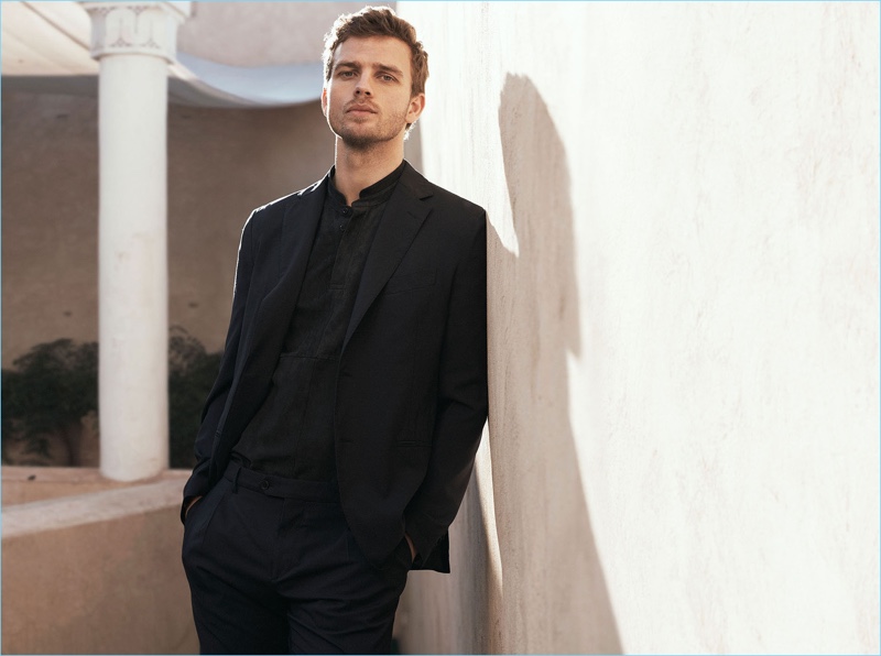 Model Benjamin Eidem dons a black suit for Massimo Dutti's spring-summer 2017 campaign.