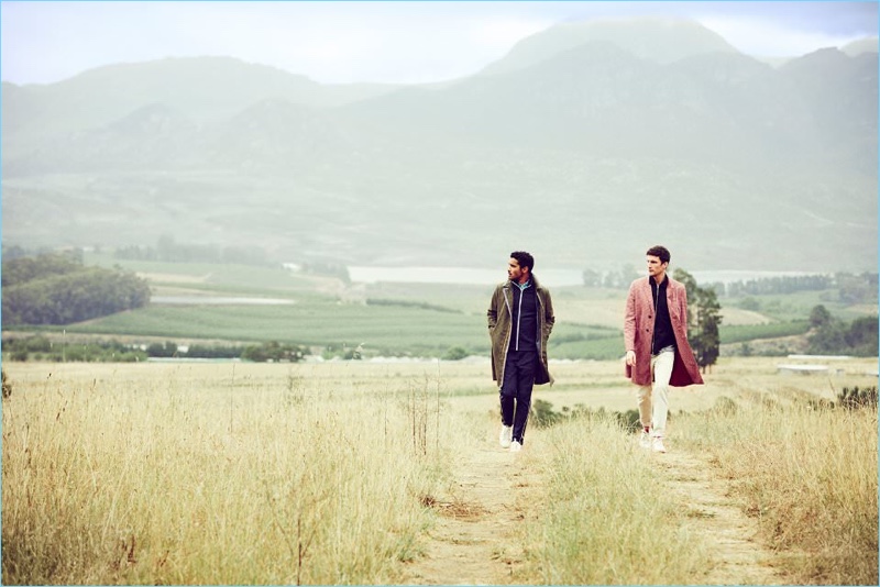 Left: Alex Cruz wears a spring look by Prada with Common Projects sneakers. Right: Charlie Timms dons a red Prada coat over an Our Legacy jacket with Ami denim jeans and Visvim sneakers.