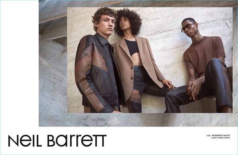 Sporting leather from Neil Barrett, models Swann Guerrault, Tarah Rodgers, and Keiron Caynes appear in the brand's spring-summer 2017 campaign.