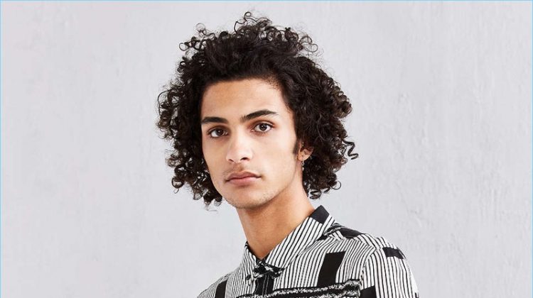 Model Tre Samuels sports Neuw's black lines rayon button-down shirt from Urban Outfitters.