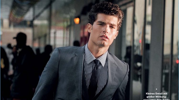 Embracing a business look, Paolo Anchisi wears a suit by HUGO Hugo Boss.