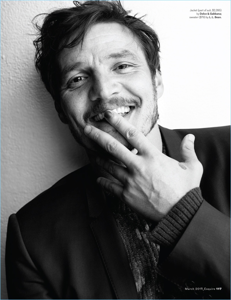 All smiles, Pedro Pascal wears a Dolce & Gabbana jacket with a L.L. Bean sweater.