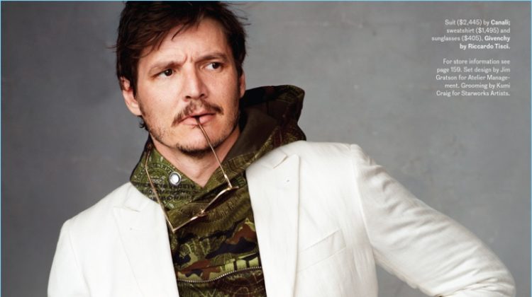 Narcos actor Pedro Pascal sports a Canali suit with a sweatshirt and sunglasses by Givenchy.
