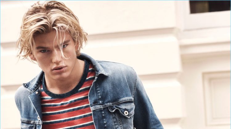 Jordan Barrett rocks jeans and a denim jacket with a striped tee for Pepe Jeans' spring-summer 2017 campaign.