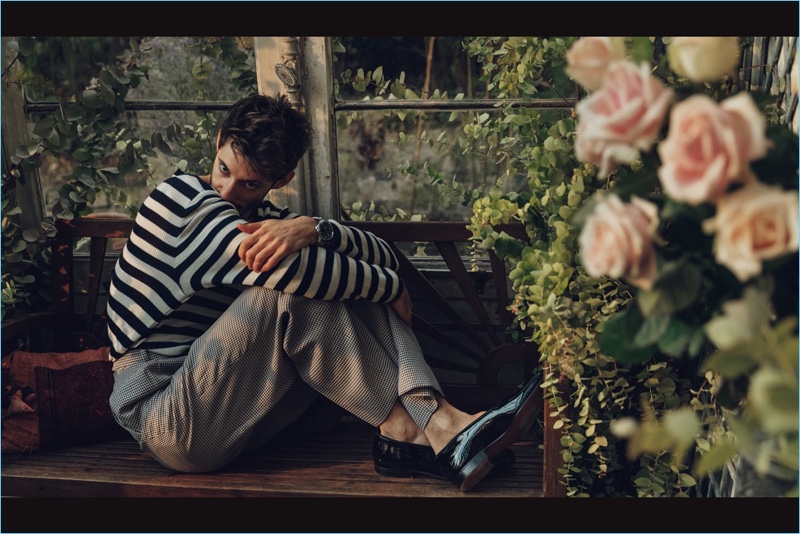 Norman Jean Roy photographs Pierre Niney in a striped Ermanno Scervino sweater with Fendi trousers and Church's dress shoes.