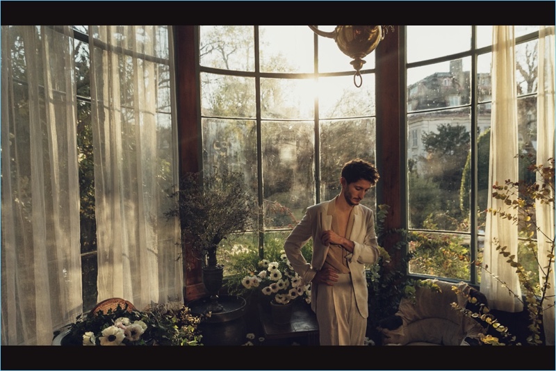 Picture-perfect, Pierre Niney wears a neutral look by Bottega Veneta.