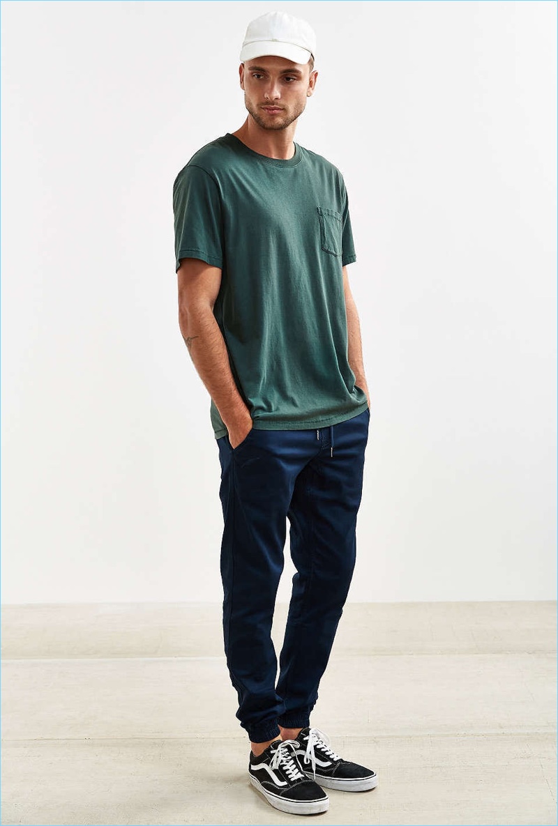 Urban Outfitters styles Publish's turquoise joggers with a simple pocket tee.