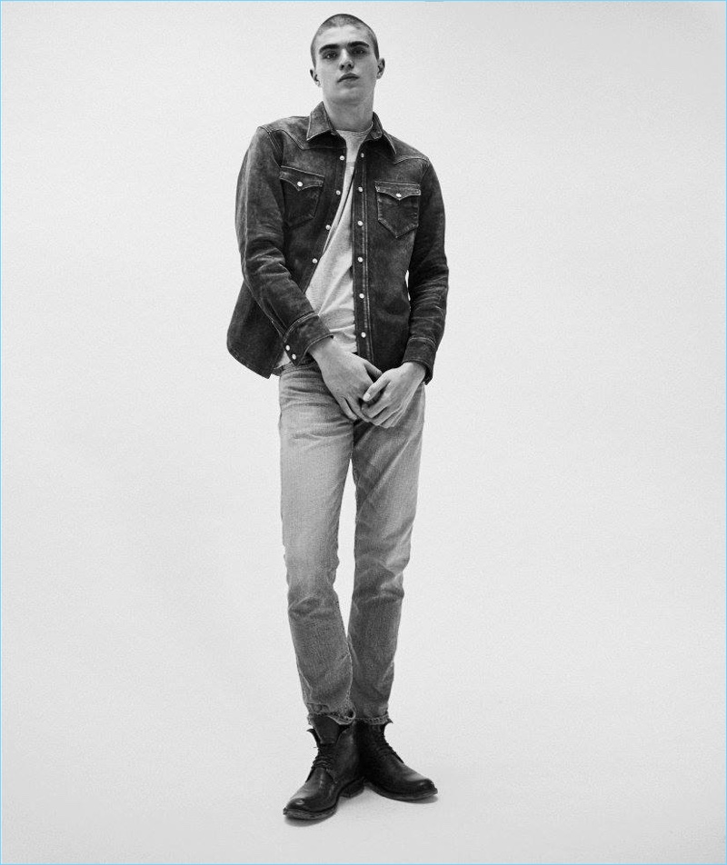 Doubling down on denim, Diego Villarreal wears a suede shirt and jeans by RRL with Rick Owens army boots.