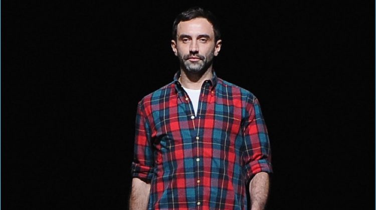 Designer Riccardo Tisci takes the catwalk following a show for Givenchy.