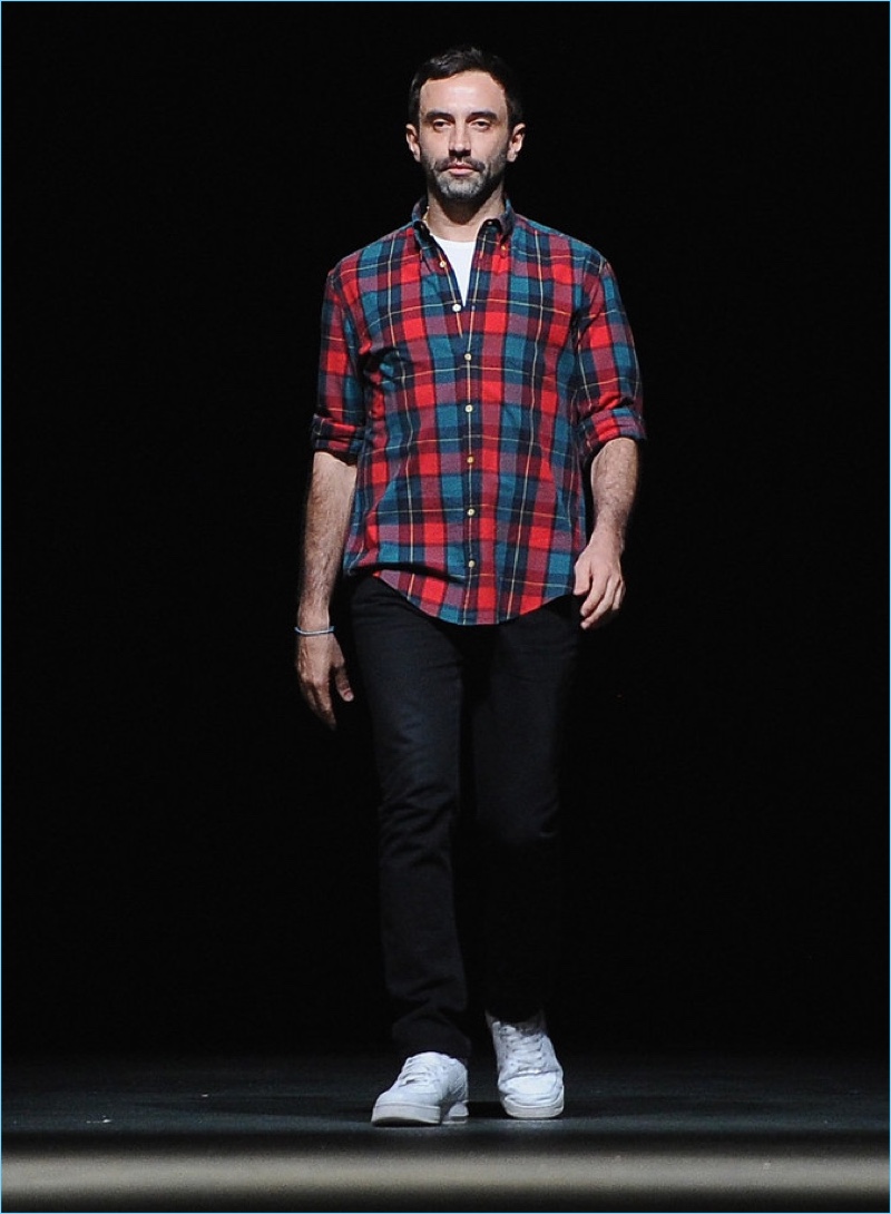 Designer Riccardo Tisci takes the catwalk following a show for Givenchy.