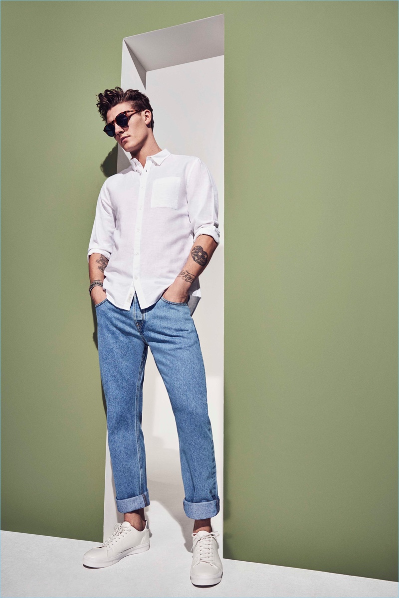 Showing minimal classics, River Island makes a case for the white button-down and denim jeans.
