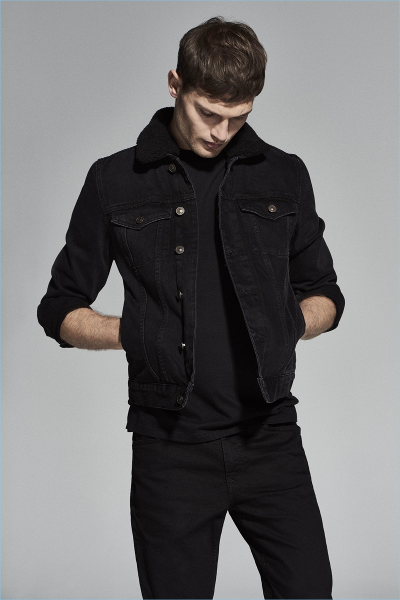 Doubling down on black denim, Stefan Pollmann sports a look from River Island.