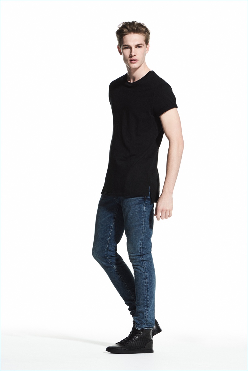Model Tommy Marr sports a longline tee with skinny denim jeans from River Island.