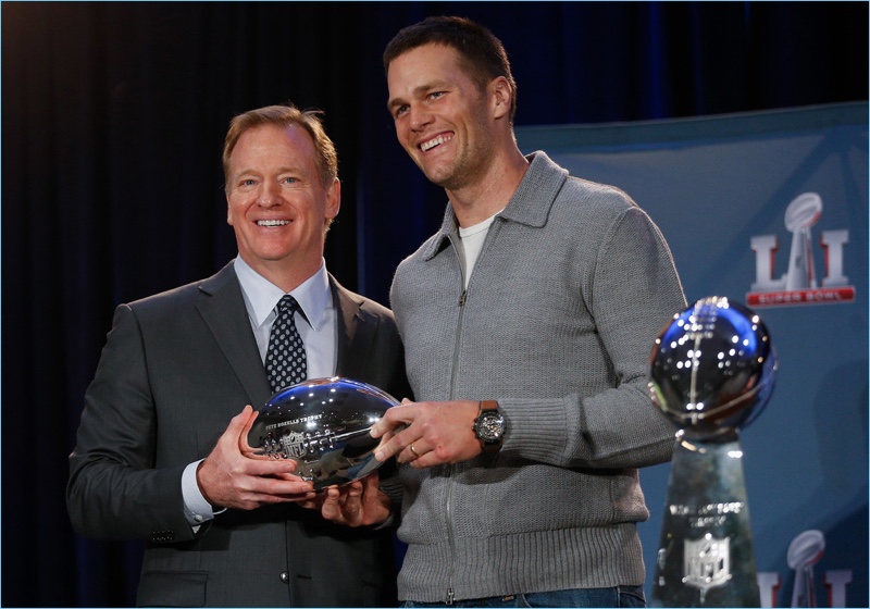 Tom Brady poses for pictures with NFL Commissioner Roger Goodell at the Super Bowl Winner and MVP press conference in Houston, Texas.