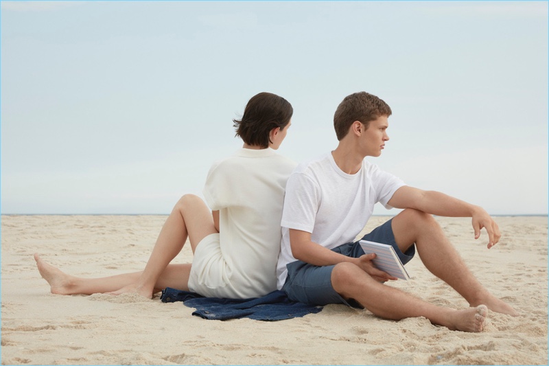 Models Jane Moseley and Will Dailey relax on the beach for Sunspel's spring-summer 2017 campaign.