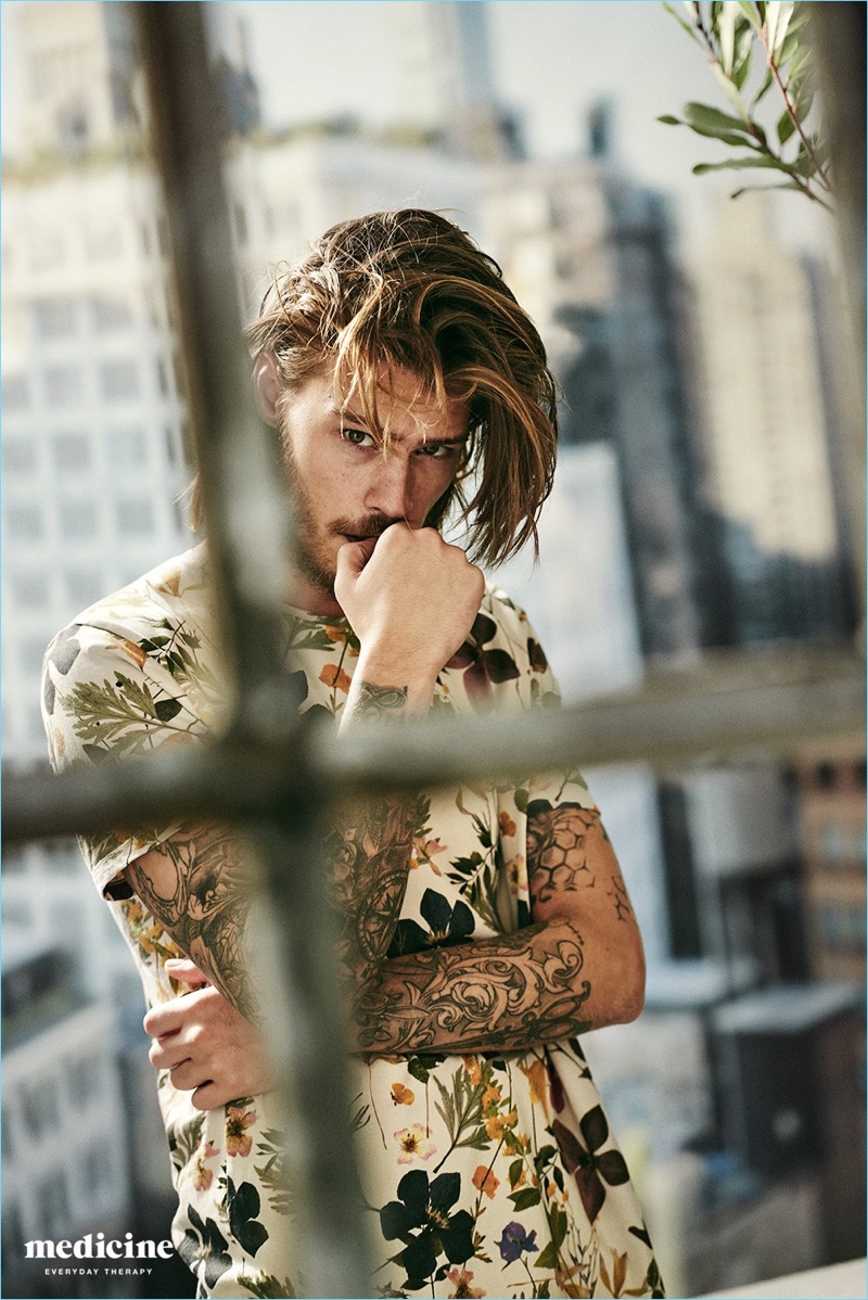 Model Teun Koemans sports a floral print tee for Medicine's spring-summer 2017 campaign.