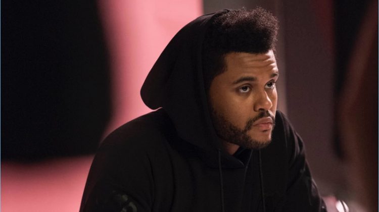 Sporting a hooded sweatshirt, The Weeknd poses for a spring H&M campaign.