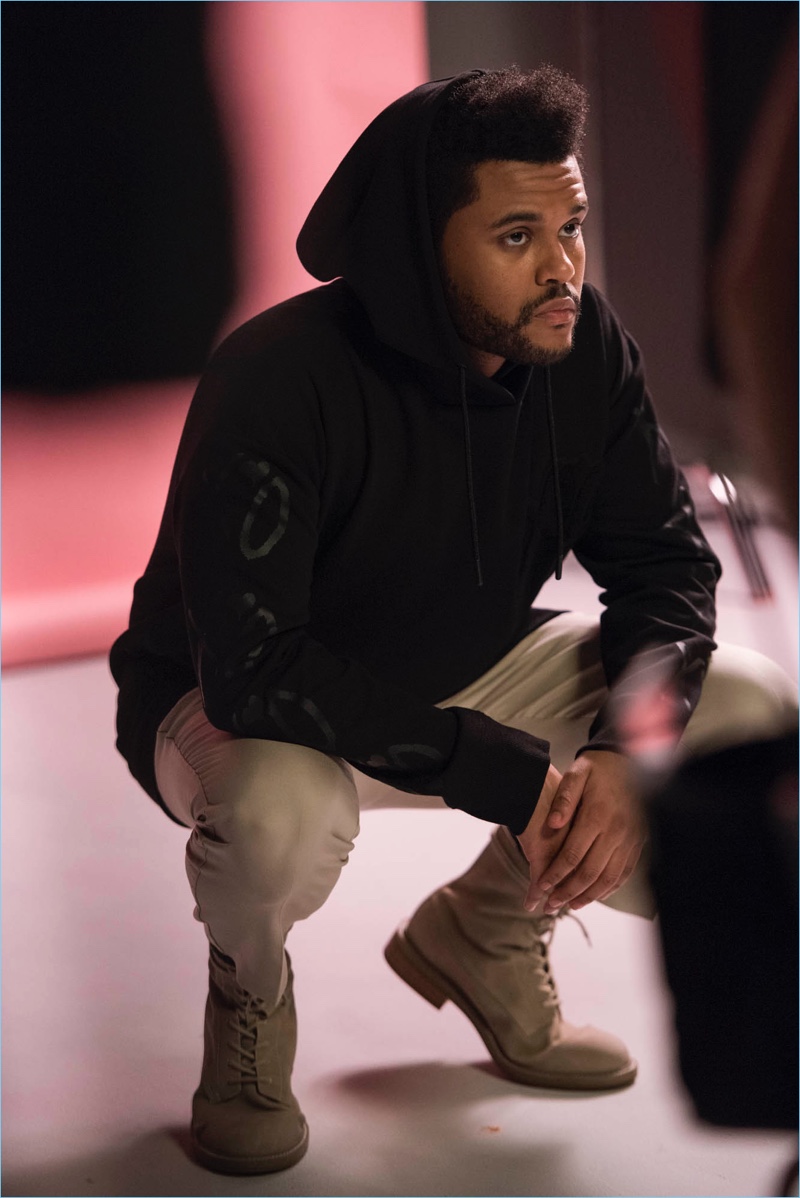 Sporting a hooded sweatshirt, The Weeknd poses for a spring H&M campaign.