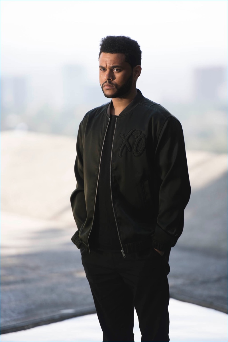 Stepping outdoors, The Weeknd wears a bomber jacket for his H&M campaign.