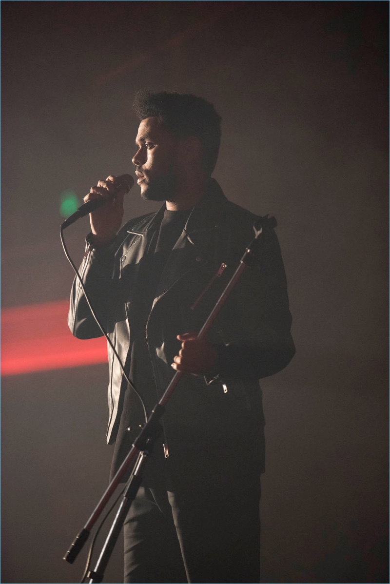 Performing, The Weeknd sports a leather jacket for his H&M campaign.