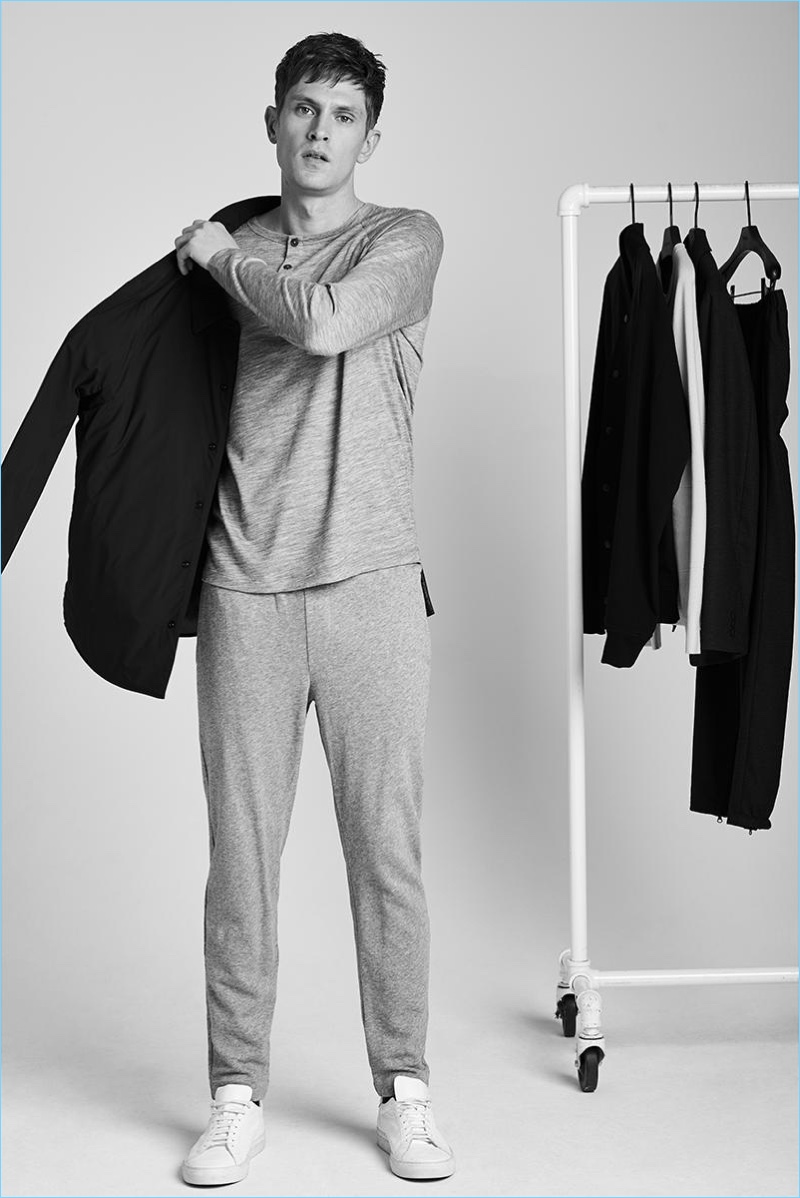 The very image of leisure, Mathias Lauridsen sports Theory's wool jersey henley with a coach jacket and sweatpants.