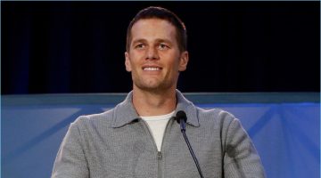 February 2017: Tom Brady dons a full-zip grey wool cardigan sweater by Tom Ford.