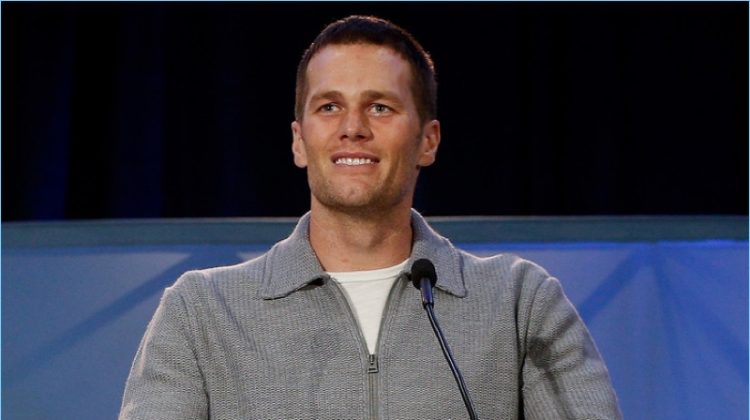 February 2017: Tom Brady dons a full-zip grey wool cardigan sweater by Tom Ford.