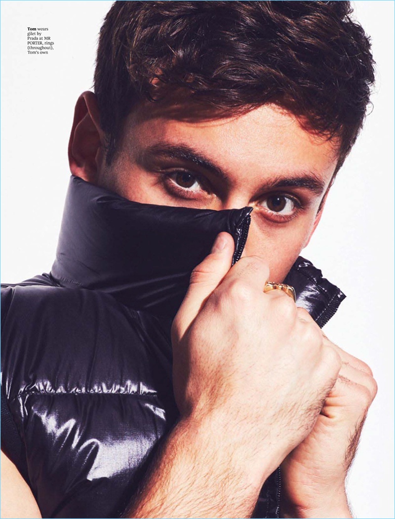 Appearing in a photo shoot for Attitude, Tom Daley plays coy in a Prada vest.